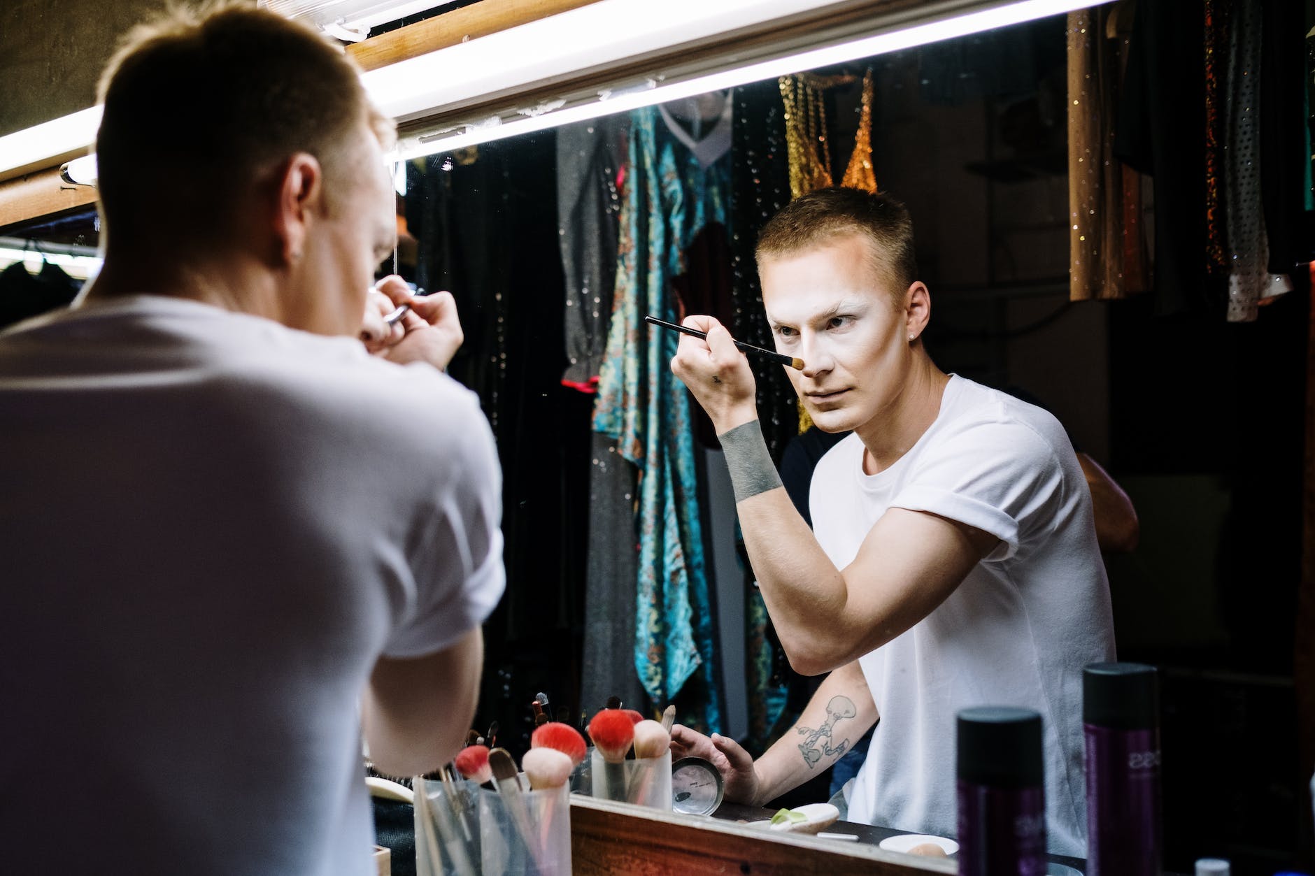 drag queen applying makeup