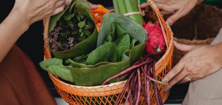close up photo of fruits and vegetables on wicked basket