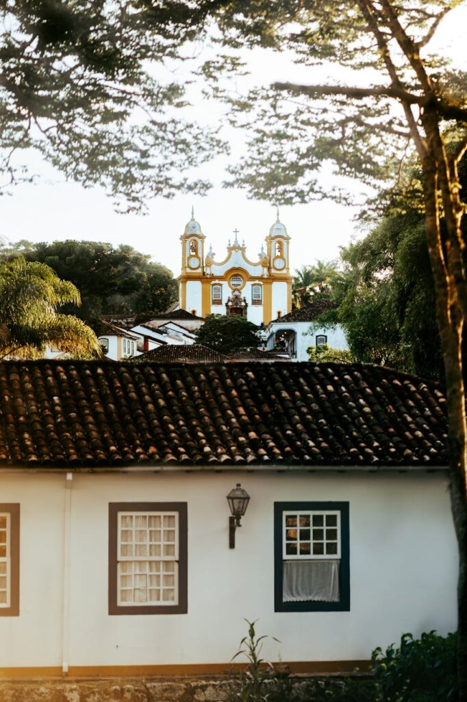 view of a house and the mother church of saint anthony in the background in tiradentes minas gerais brazil